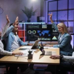 Voozon platform review, features, and digital business tools discussed by a professional team in a meeting.