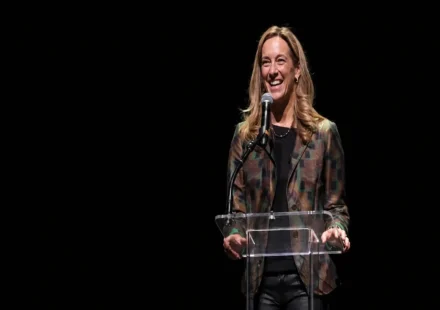 Amy Sherrill speaking at a public event as people search for her background and biography