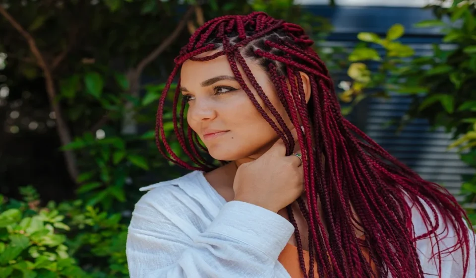 Braided wig with knotless box braids in dark brown color